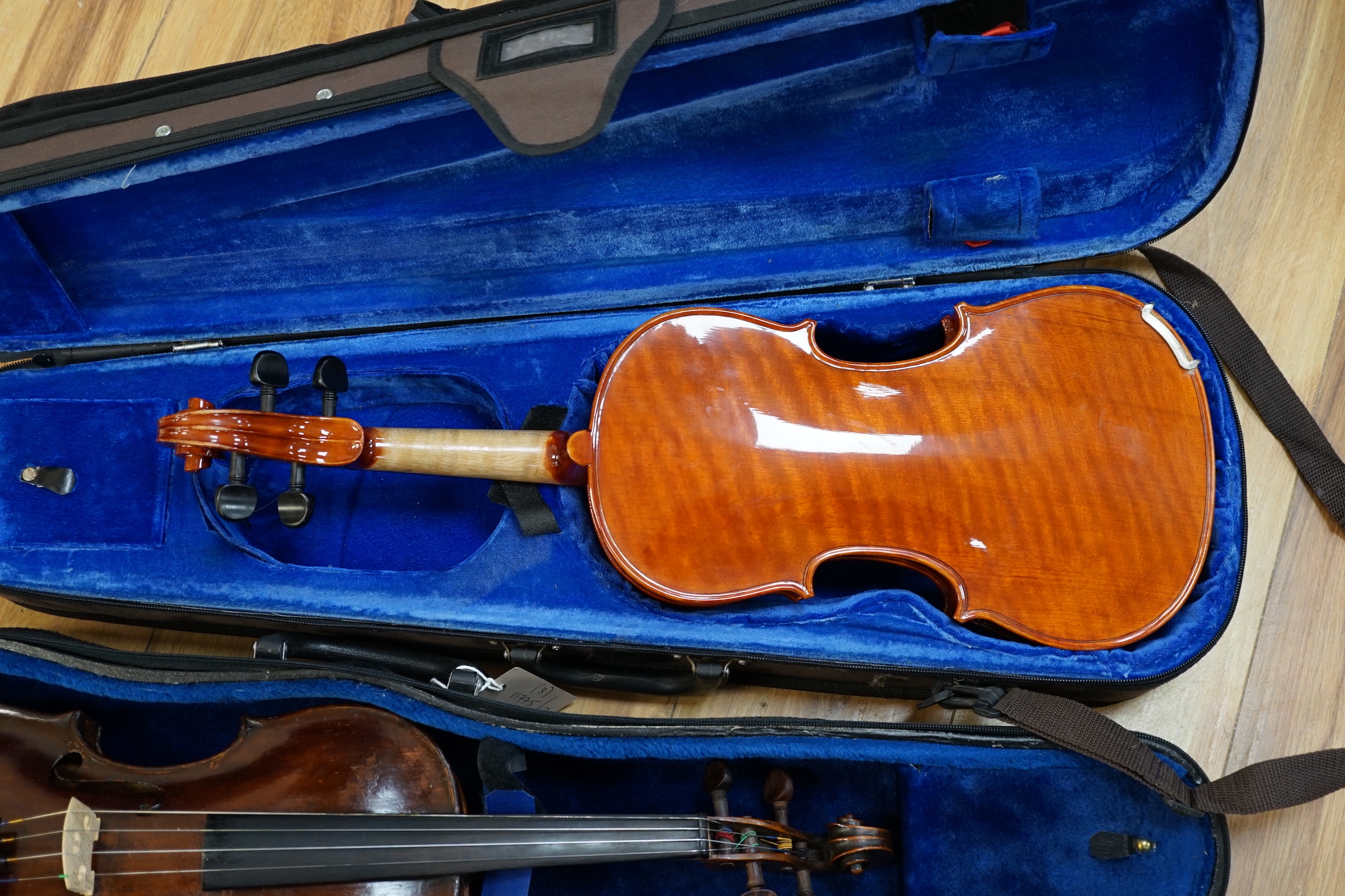 A 19th century English violin, bears hand written paper label, a modern Stentor violin and a metronome